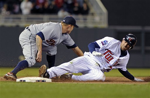 J.J. Hardy injures his wrist sliding into third on a triple against the Detroit Tigers on May 4, 2010.
